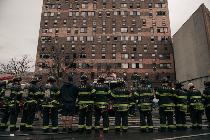 Emergency first responders at the scene following an intense fire at a 19-story residential building Sunday in the Bronx.