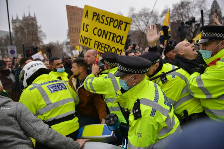 Anti vaccine and anti vaccine pass protesters joined by opponents of Covid 19 restrictions clash with police at Parliament Square.