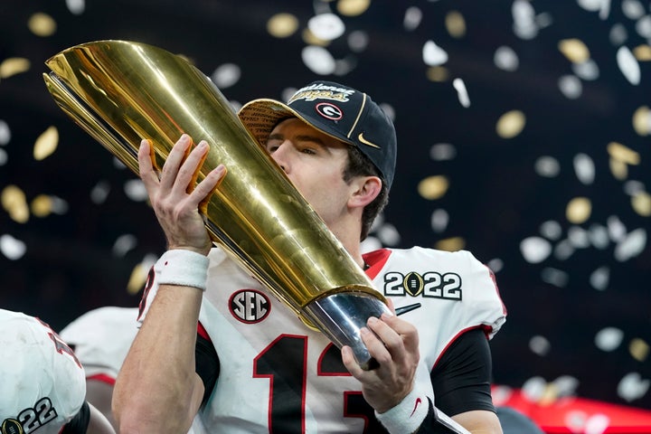 Georgia's Stetson Bennett celebrates after the College Football Playoff championship football game against Alabama Tuesday, Jan. 11, 2022, in Indianapolis. Georgia won 33-18. (AP Photo/Darron Cummings)