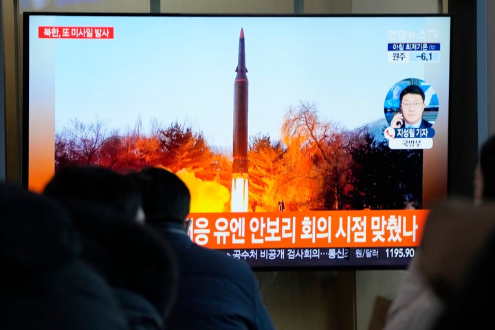 People watch a TV showing a file image of North Korea's missile launch during a news program at the Seoul Railway Station in Seoul, South Korea, on Jan. 11, 2022.