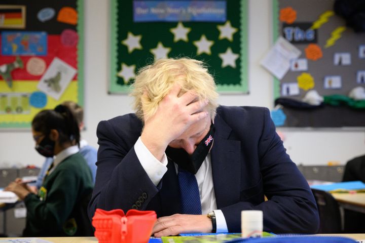 Boris Johnson speaks with pupils in a maths class as he makes a constituency visit to Oakwood School on January 10, 2022