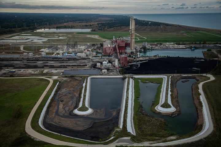 Two unlined ash ponds are seen in the foreground of the coal-fired NRG Waukegan Generating Station in Waukegan, Illinois, in 2018.