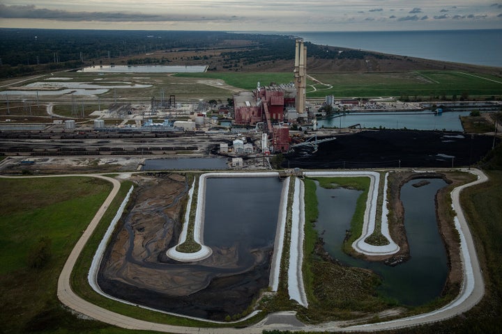 Two unlined ash ponds are seen in the foreground of the coal-fired NRG Waukegan Generating Station in Waukegan, Illinois, in 2018.