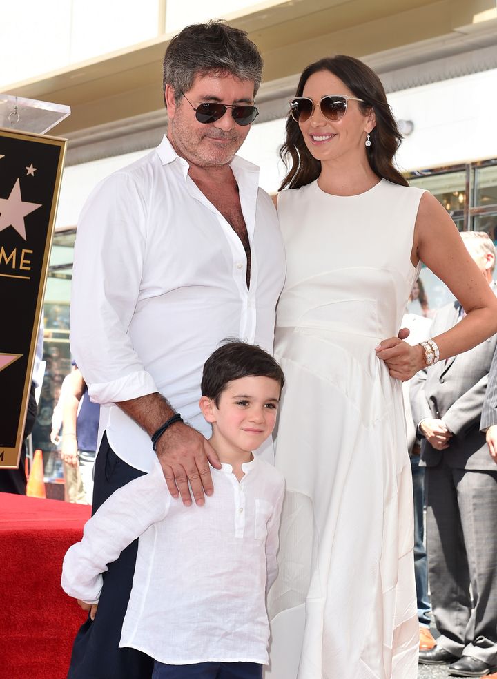 The couple with their son Eric at Simon's Hollywood star unveiling