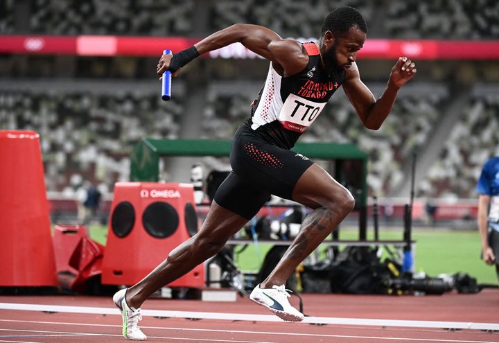 Deon Lendore competes in the men's 4x400m relay heats for Trinidad and Tobago during the Tokyo Olympic Games.