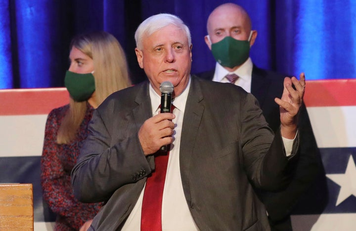 West Virginia Gov. Jim Justice said in a statement he woke up with a cough and congestion, then developed a headache and high fever.