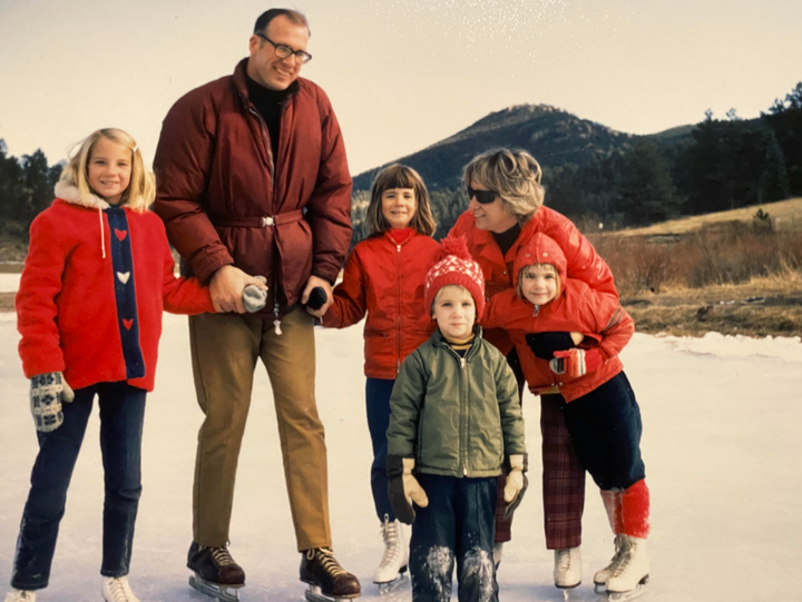"While other family members refuse to engage, I’m triggered into a primordial rage by the videos he texts me 'because he loves me and wants to help me wake up before it’s too late,'" writes Sue Muncaster (center), pictured with her little brother (in the green coat) and the rest of their family in 1969.