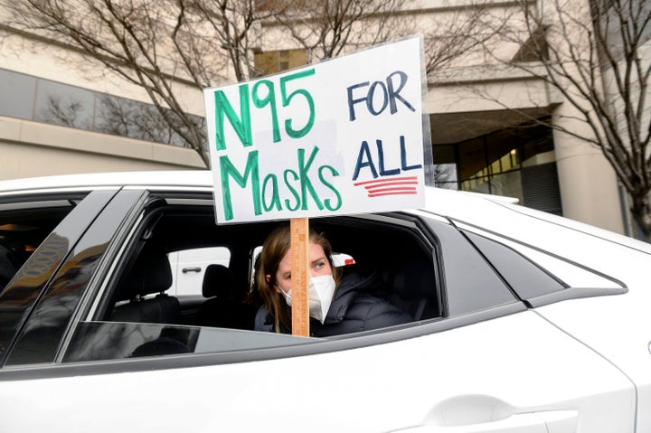 Elementary school teacher Carrie Landheer protests for stronger COVID-19 safety protocols outside Oakland Unified School District headquarters on last week in California.