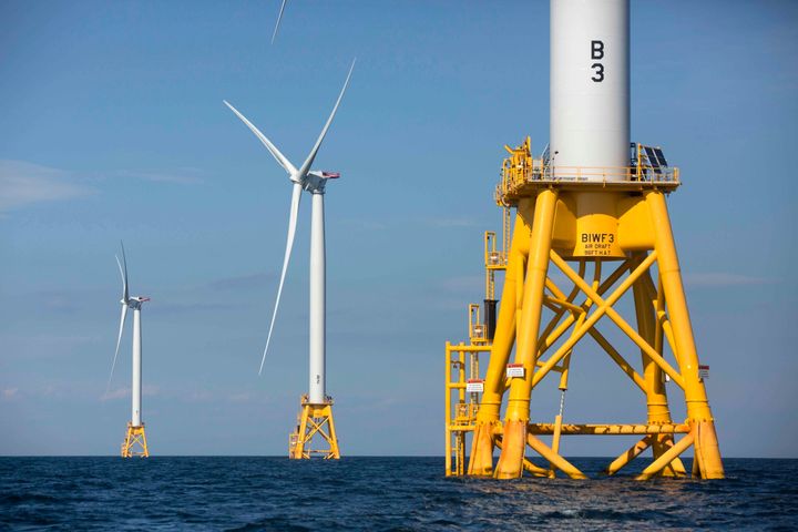 This photo from Aug. 15, 2016, shows offshore wind turbines near Block Island, R.I. The Biden administration said Wednesday it will hold its first offshore wind auction next month, offering nearly 500,000 acres off the coast of New York and New Jersey for wind energy projects that could produce enough electricity to power nearly 2 million homes. (AP Photo/Michael Dwyer, File)