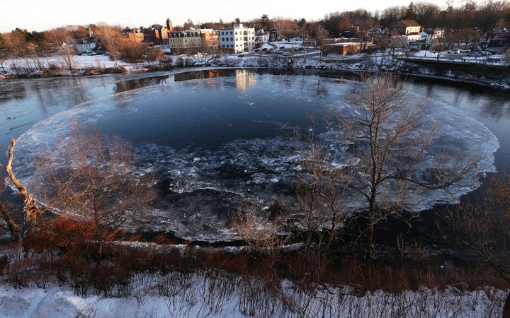 The Westbrook ice disk has returned to the Presumpscot River below Saccarappa Falls, Tuesday, Jan. 11, 2022, in Westbrook, Maine. (Ben McCanna/Portland Press Herald via AP)