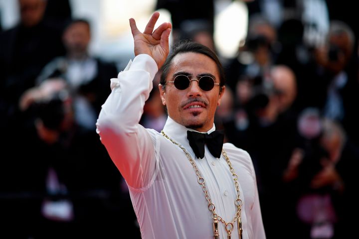 Turkish restaurateur Nusret Gokce, aka Salt Bae, has become legendary for his salting pose. Here, he does it on the red carpet at the Cannes Film Festival in 2019, even though there's no salt in sight.