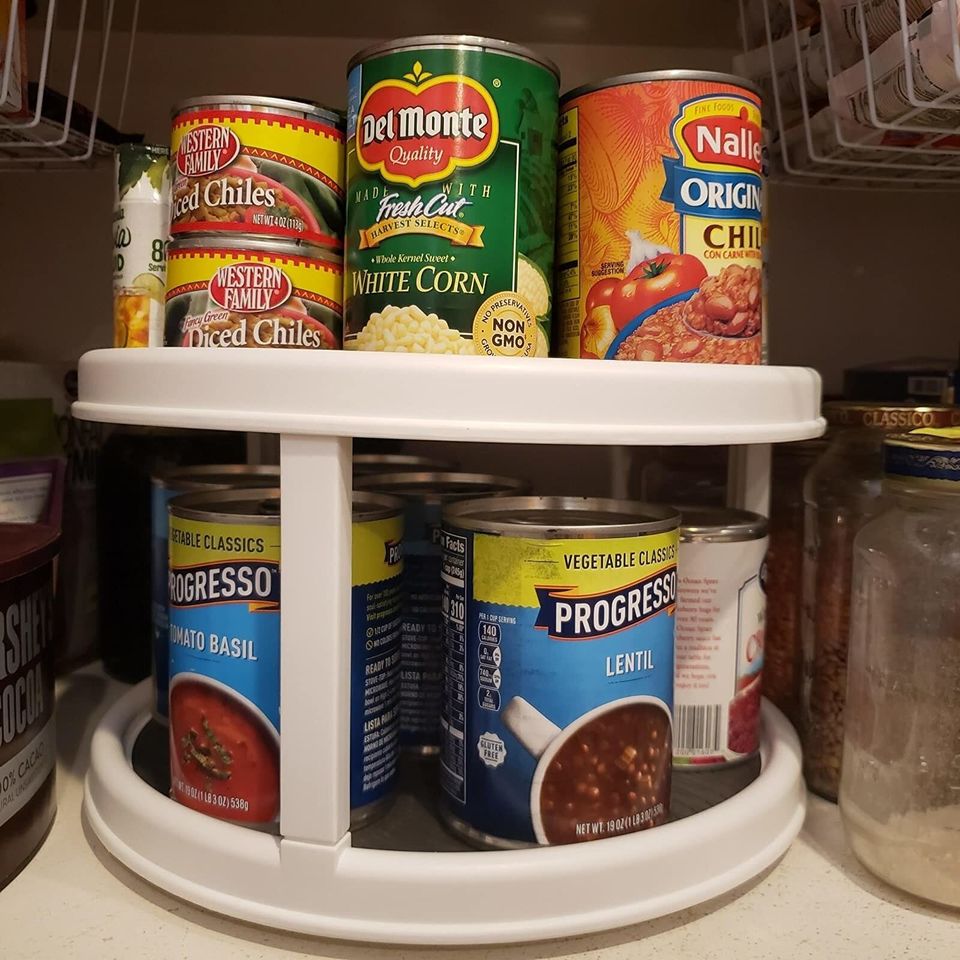 A two-tier lazy Susan strong enough to store your reserve of soup cans