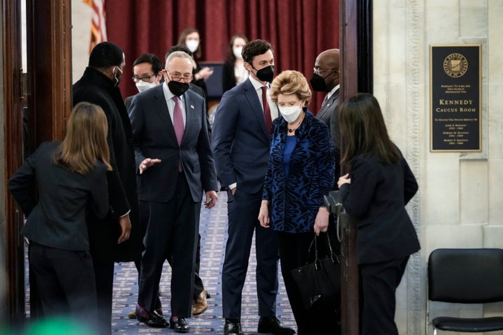 Senate Majority Leader Chuck Schumer (D-N.Y.) leaves a meeting with President Joe Biden and Senate Democrats. Sen. Joe Manchin (D-W.Va.) and Sen. Kyrsten Sinema (D-Ariz.) are opposing the passage of the president's agenda alongside Republicans. 