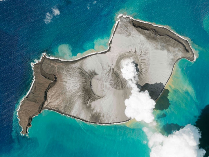 In this satellite photo taken by Planet Labs PBC, an island created by the underwater Hunga Tonga Hunga Ha'apai volcano is seen smoking Jan. 7, 2022.