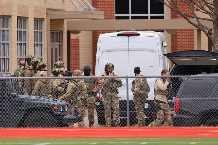 SWAT team members deploy near the Congregation Beth Israel Synagogue.