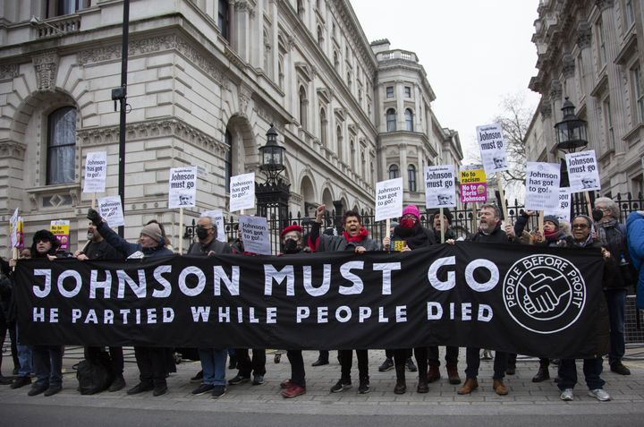 People protest against Boris Johnson outside the Prime Minister's Office on 10 Downing Street in London.