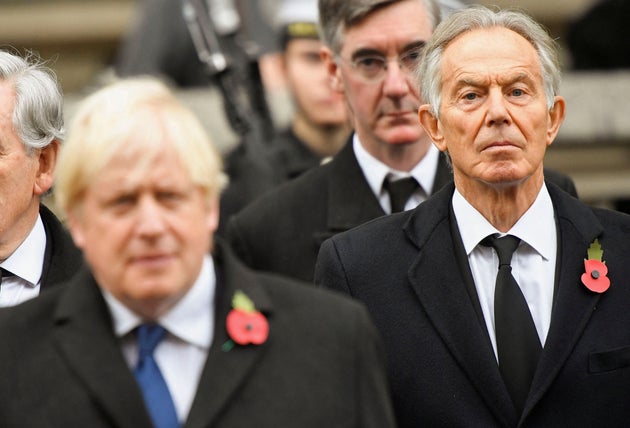 Boris Johnson and. Tony Blair attend the Remembrance Sunday ceremony at the Cenotaph on Whitehall in central London, on November 14, 2021.
