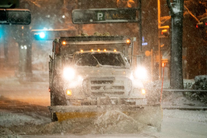 More than an inch of snow fell per hour in some parts of the Carolinas, Georgia, Tennessee and Virginia, according to the National Weather Service Storm Prediction Center. A snow plow is seen in Greenville, South Carolina.