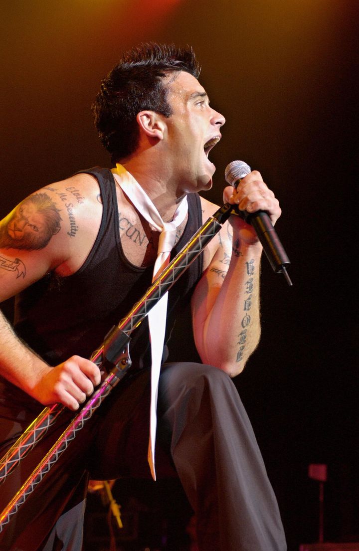 Robbie performing in 2003 to promote his hit album Escapology