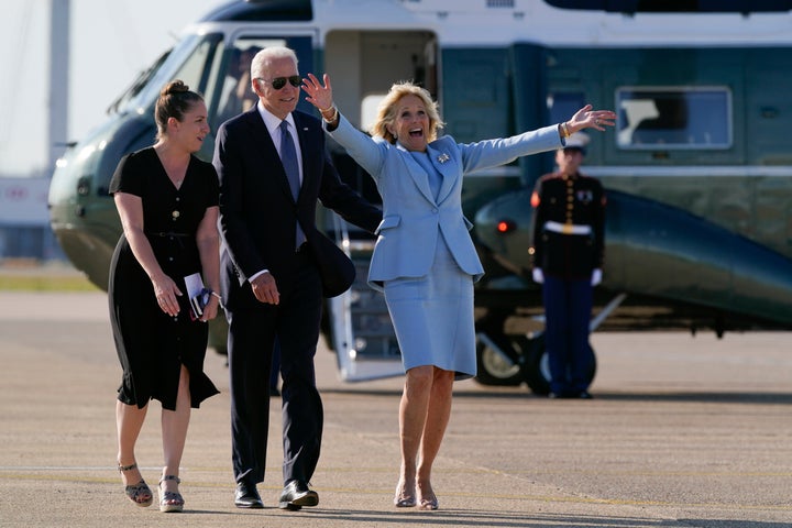 First lady Jill Biden reacts as she and President Joe Biden meet veterans of the British Armed Forces before boarding Air Force One at Heathrow Airport in London, on June 13, 2021.