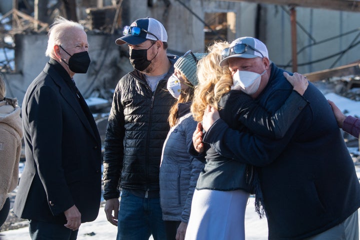 President Joe Biden and first lady Jill Biden greet local residents during a tour of a neighborhood destroyed by the Marshall Fire in Louisville, Colorado, on January 7.