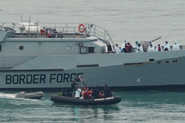 A group of people brought in to Dover, Kent, by Border Force officers.