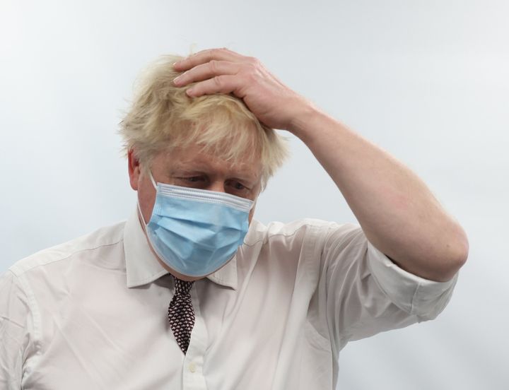 Boris Johnson talks to staff during a visit to the Finchley Memorial Hospital in North London on Tuesday.