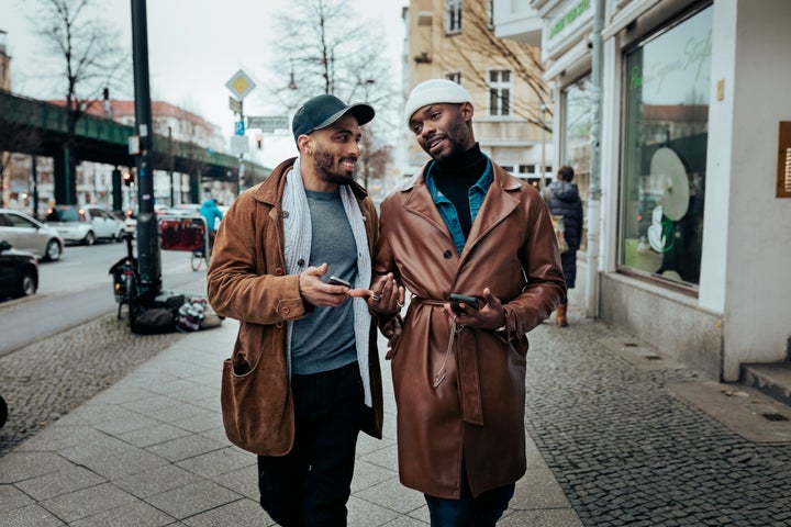 Couple walks down metropolitan street