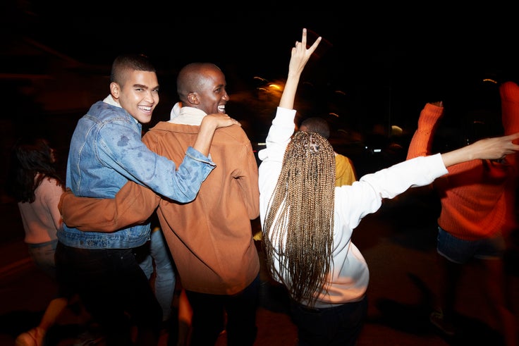 Group of friends together at night