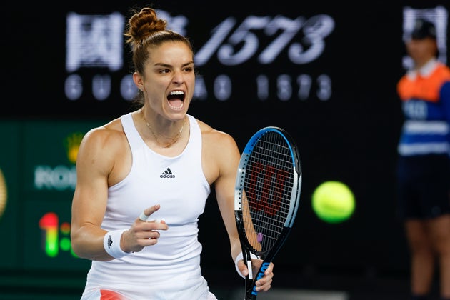 Maria Sakkari of Greece celebrates after defeating Zheng Qinwen of China in their second round match at the Australian Open tennis championships in Melbourne, Australia, Wednesday, Jan. 19, 2022. (AP Photo/Hamish Blair)