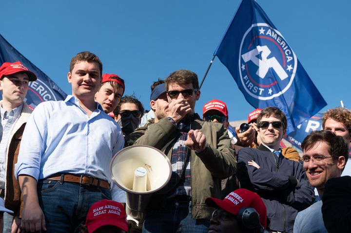 Nick fuentes speaks to "gropers" in washington dc on november 14, 2020. To his right is jake colglaser.
