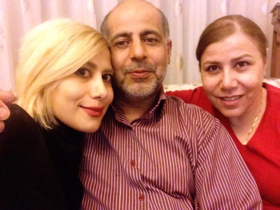 Leyla Abbasnezhad with her parents.