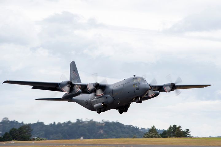A Royal New Zealand Air Force C-130 Hercules leaves an airbase in Auckland, Thursday, flying to Tonga with aid.
