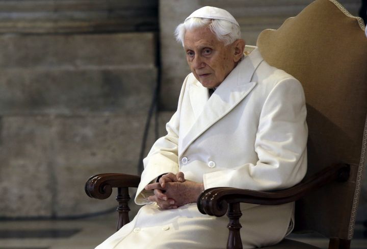 Pope Emeritus Benedict XVI sits in St. Peter's Basilica as he attends the ceremony marking the start of the Holy Year, at the Vatican, Dec. 8, 2015. 