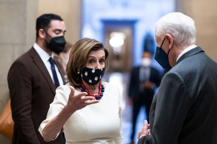 House Speaker Nancy Pelosi (D-Calif.) and Rep. Steny Hoyer (D-Md.) talk outside of the speaker's office. Pelosi said Thursday that she is open to banning lawmakers from owning and trading individual stocks if that's what members of her caucus want. 