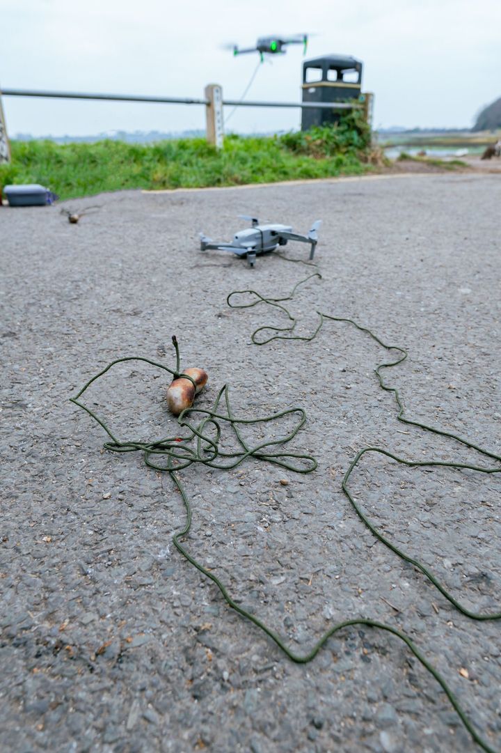 The sausage, attached to a drone.