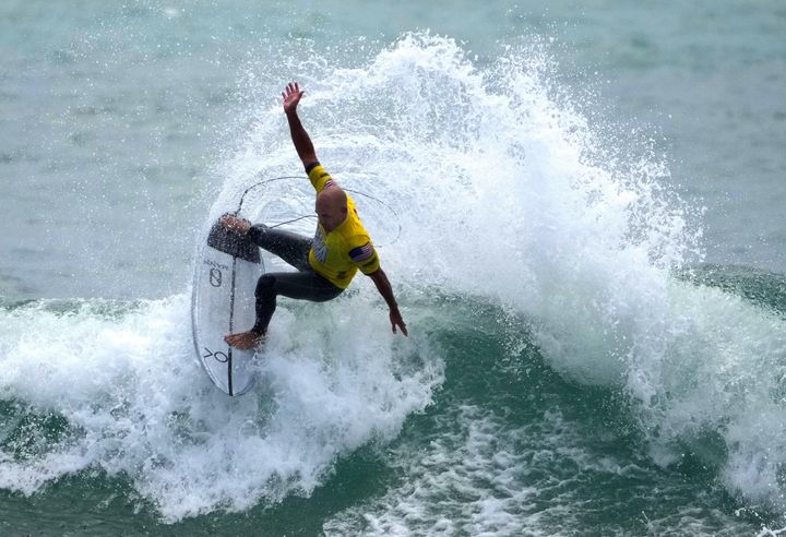 Surfer Kelly Slater shows off during an Olympic exhibition at the USA Surfing Junior championships at the Lower Trestles in San Clemente on June 22, 2021.