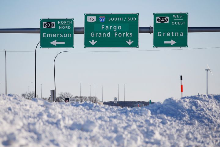 Road signage is posted just outside of Emerson, Manitoba, on Jan. 20, 2022. 