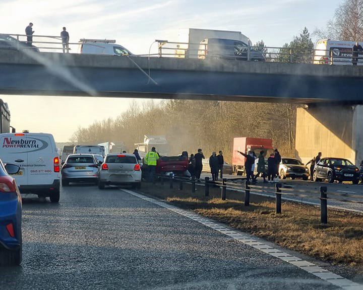 The scene at Bowburn interchange on the A1(M) as a passenger has been flown to hospital after a car fell from a bridge and landed in the middle of the busy motorway.