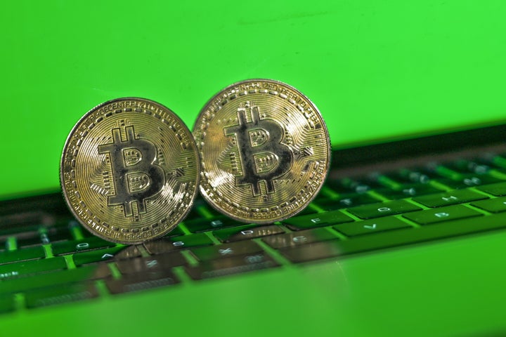 Illustrative image of two commemorative bitcoins with a green background. On Wednesday, January 19, 2021, in Edmonton, Alberta, Canada. (Photo by Artur Widak/NurPhoto via Getty Images)