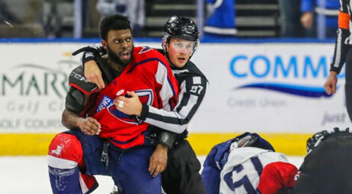 Jordan Subban is held by the referee after he was allegedly taunted by Jacob Panetta in a minor league hockey game.