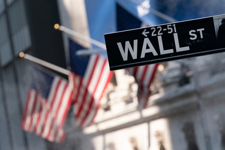 A sign for Wall Street hangs in front of the New York Stock Exchange, July 8, 2021. (AP Photo/Mark Lennihan, file)