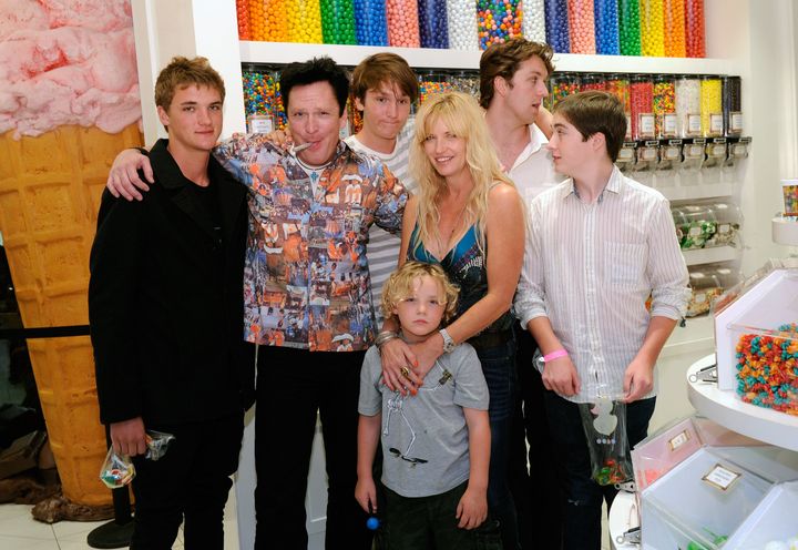 Hudson Madsen (far-left) pictured with his father, Michael, and their family in 2011