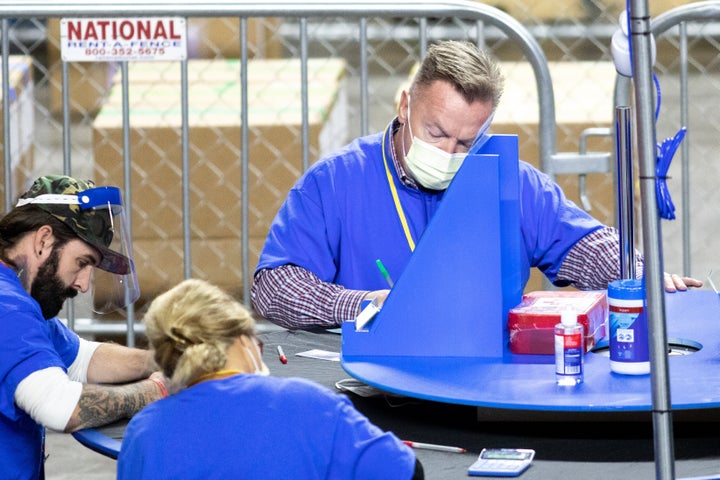 Former Arizona state Rep. Anthony Kern recounts ballots from the 2020 general election. The Maricopa County ballot recount followed two election audits that found no evidence of widespread fraud in Arizona.