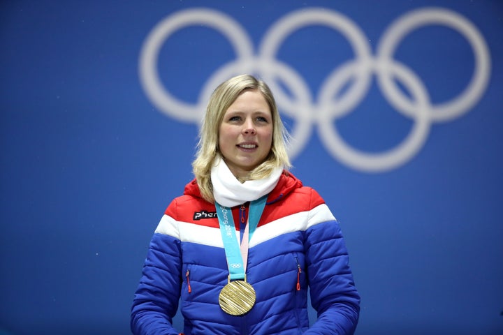 Gold medalist Maren Lundby of Norway after winning a ski jump event at the 2018 Winter Olympics.