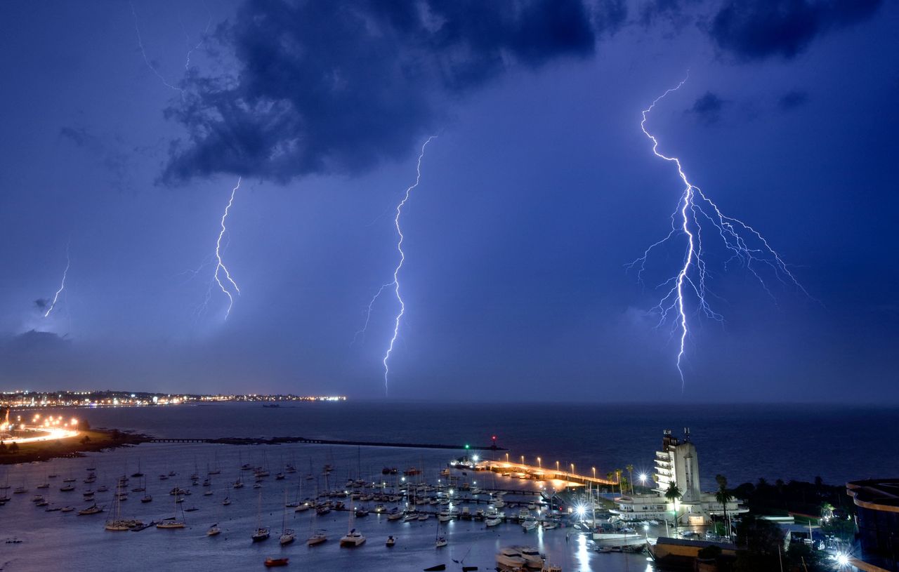 Lightning bolts strike near the Uruguayan Yacht Club during a thunderstorm in Montevideo on Saturday. 