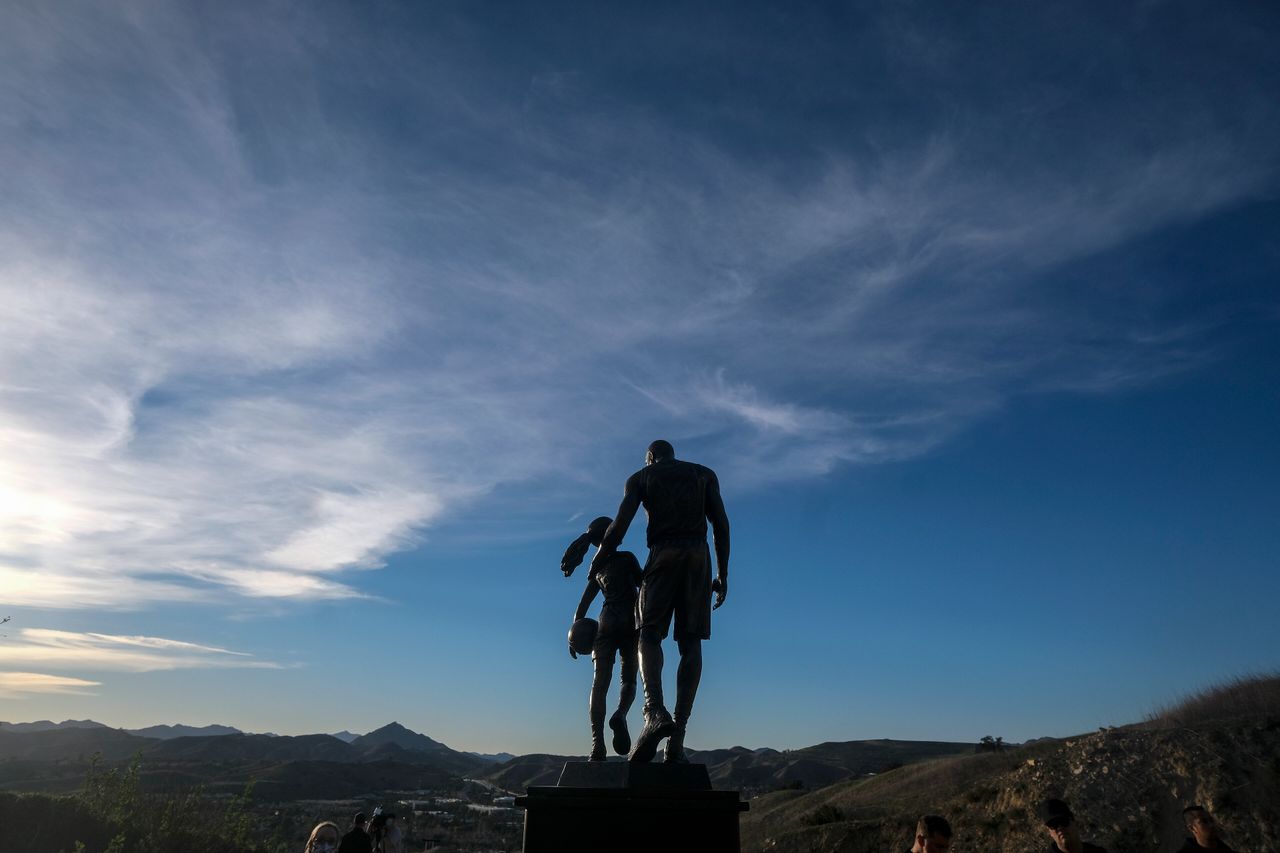 A bronze sculpture honoring former Los Angeles Lakers player Kobe Bryant, his daughter Gianna Bryant, and others who died in a 2020 helicopter crash is displayed at the crash site in Calabasas, California, on Wednesday.
