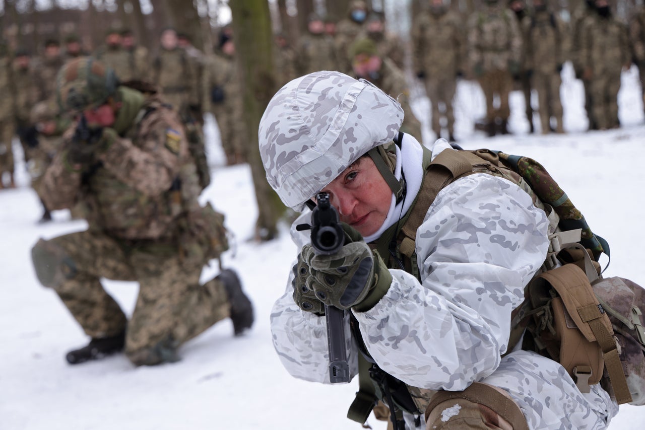 Mariana, 52, a marketing researcher who for the past two years has been a volunteer in a Kyiv Territorial Defence unit, trains on Saturday. Across Ukraine, thousands of civilians are participating in such groups to receive basic combat training.