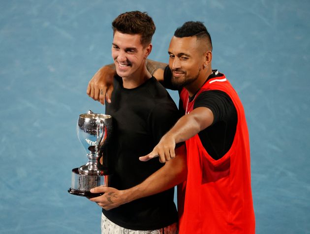 Tennis - Australian Open - Men's Doubles Final - Melbourne Park, Melbourne, Australia - January 29, 2022 Australia's Nick Kyrgios and Thanasi Kokkinakis celebrate winning the final against Australia's Matthew Ebden and Max Purcell with the trophy REUTERS/Asanka Brendon Ratnayake