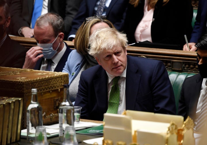 In this photo provided by UK Parliament, British Prime Minister Boris Johnson attends Prime Minister's Questions in the House of Commons, in London, Jan. 19, 2022.